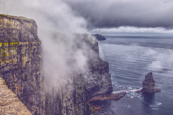 Enigmatic Mist Rolling Fog at the Cliffs of Moher